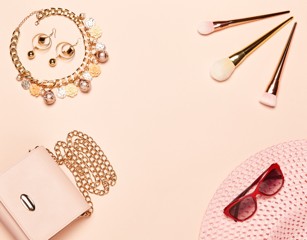 Fashion lady accessories set. Falt Lay. Stylish handbag. Make-Up brushes. Jewelry. Summer sunglasses and hat. Women accessories