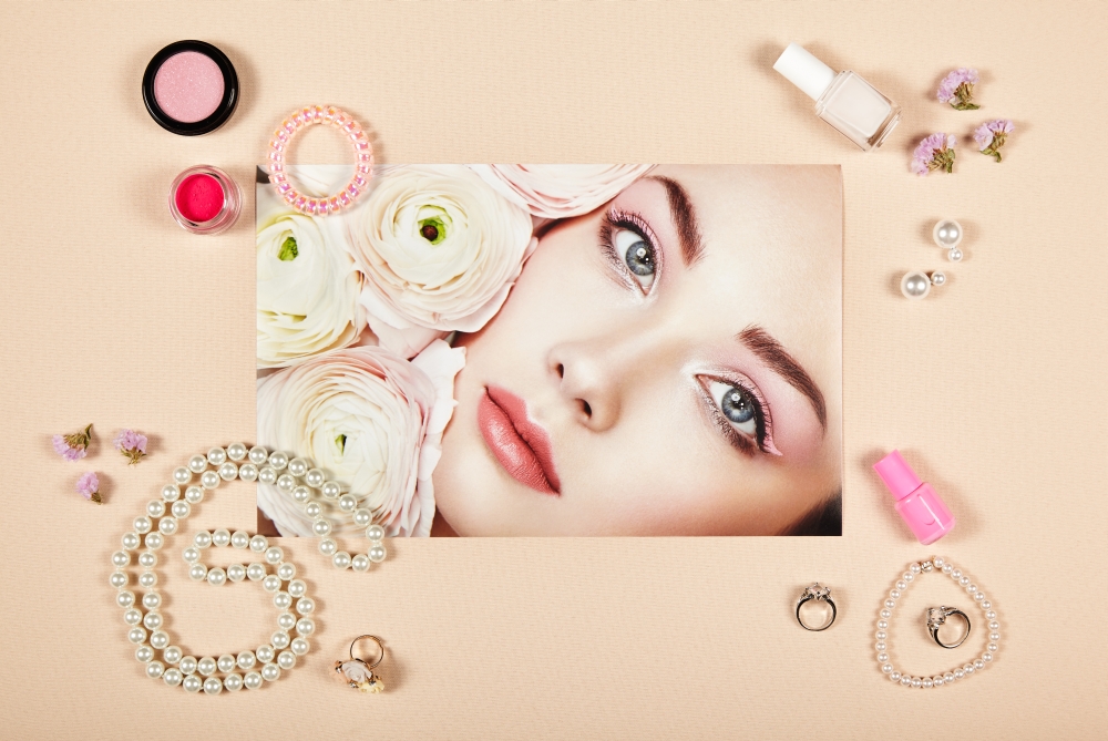 Fashion lady accessories collage. Falt Lay. Beauty photography. Make-Up brushes. Jewelry and nail polish. Portrait of beautiful young woman with flowers