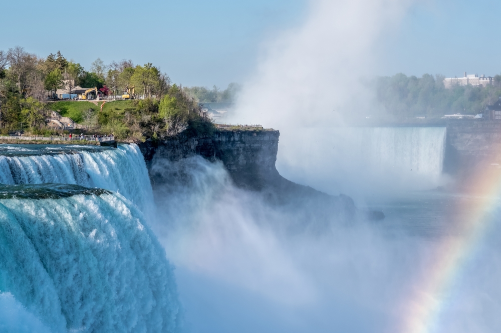 American side of Niagara Falls waterfall with rainbow, New York, USA