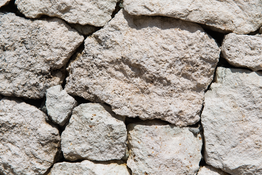 stonework, masonry, background and texture concept - grainy stone wall. stone wall texture