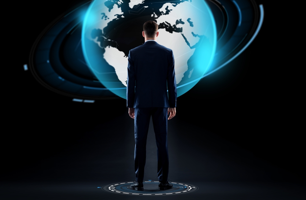 business, people and technology concept - businessman in suit with earth globe hologram over black background. businessman with earth globe hologram over black