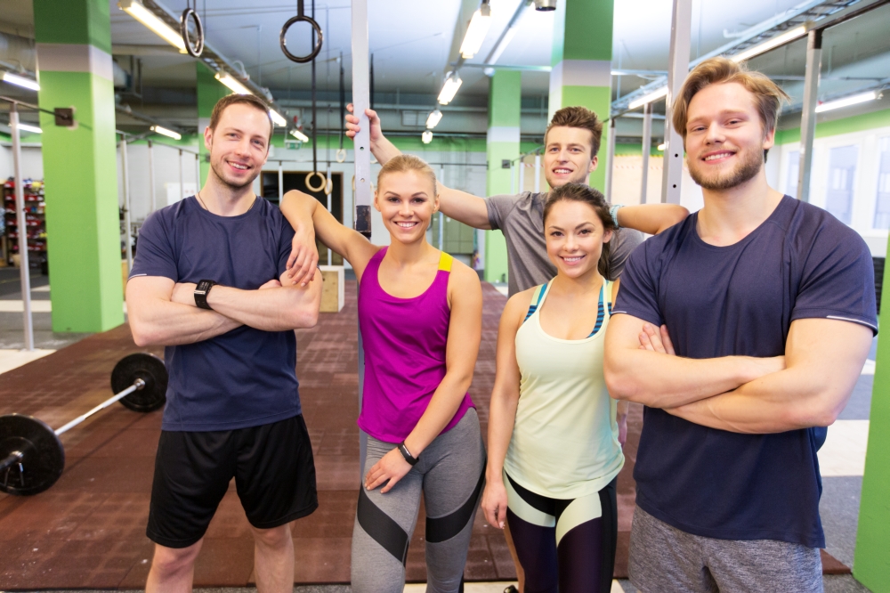 fitness, sport and people concept - group of happy friends in gym. group of happy friends in gym. group of happy friends in gym