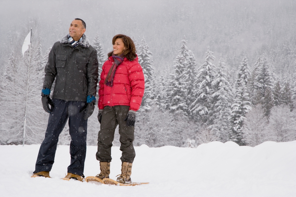 Portrait of a mature couple wearing snowshoes