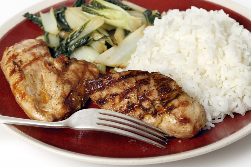 Soy sauce marinaded chicken breasts served with sauteed pak choi and Thai Jasmine rice