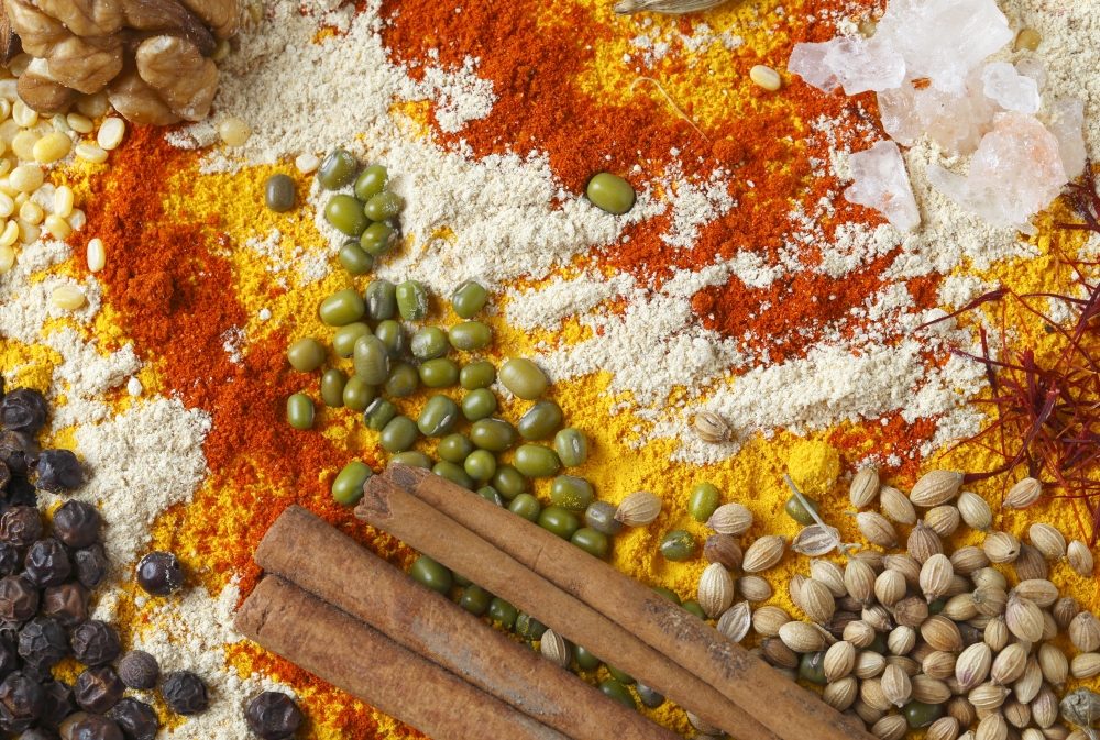 View of an assortment of spices and  ingredients used in indian and other asian cuisines.