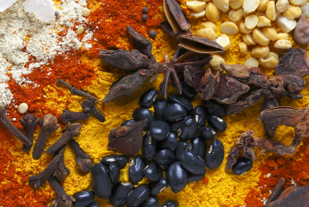View of an assortment of spices and  ingredients used in indian and other asian cuisines.