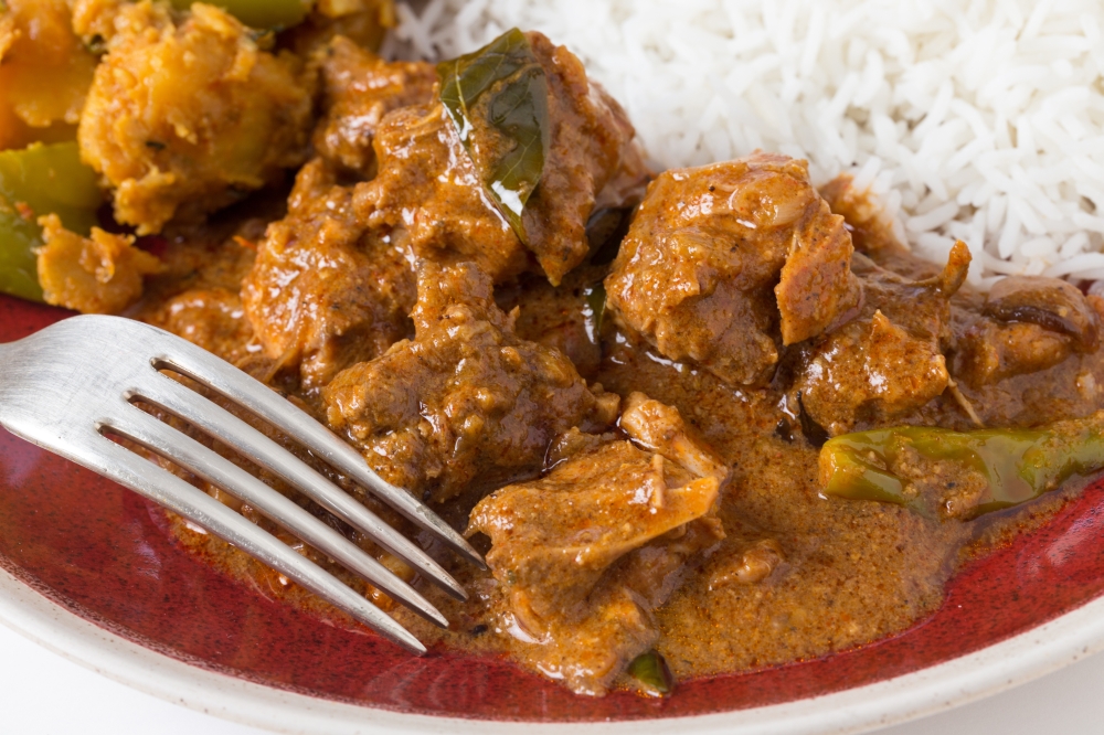 Chettinadu traditional Indian chicken bone-in curry, served with white rice