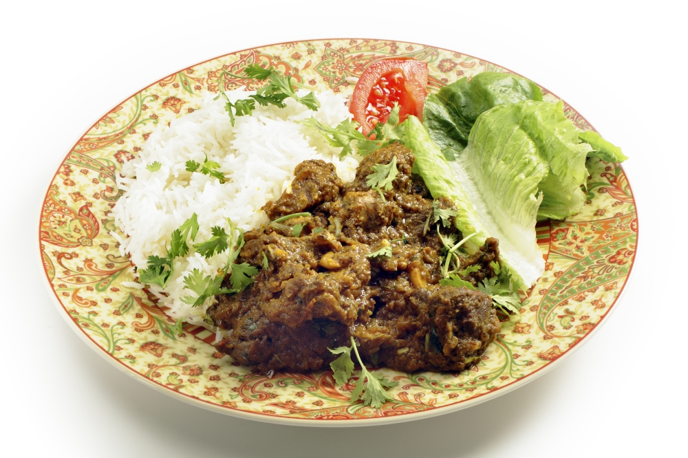 North Indian or Pakistani style bhuna ghosht, a fairly dry lamb curry, served with rice and a salad