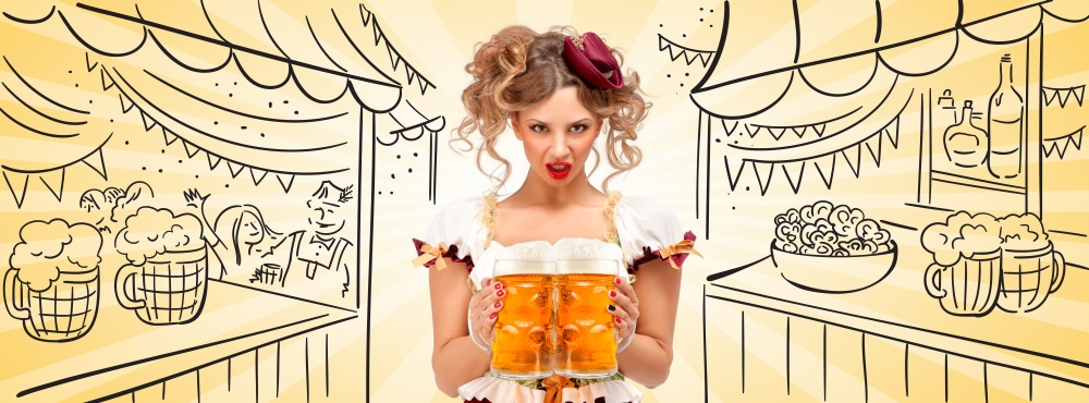 Beautiful sexy waitress wearing a traditional Bavarian dress dirndl, serving two big beer mugs on sketchy Oktoberfest background.