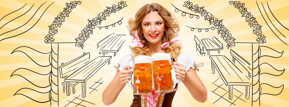 Beautiful sexy Oktoberfest woman wearing a traditional Bavarian dress dirndl serving two beer mugs with happy smile on sketchy Oktoberfest tent entrance background.