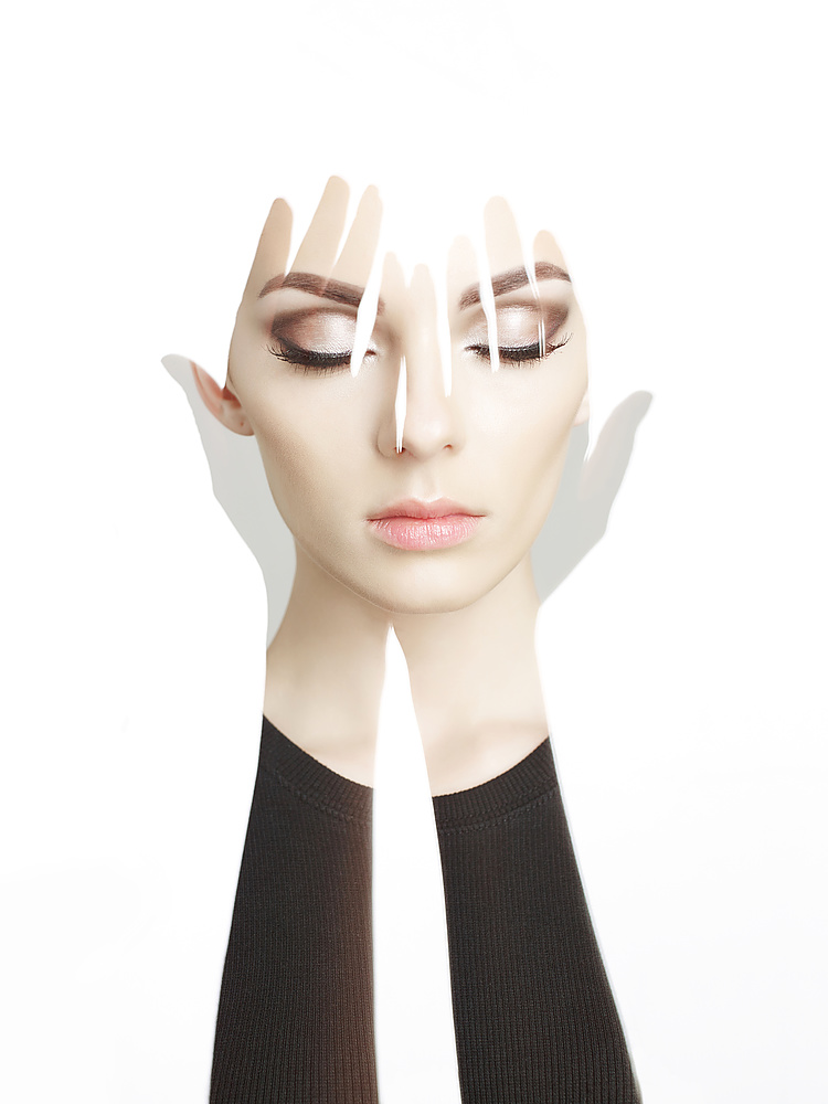 Conceptual art fashion studio photo of beautiful young woman with perfect makeup