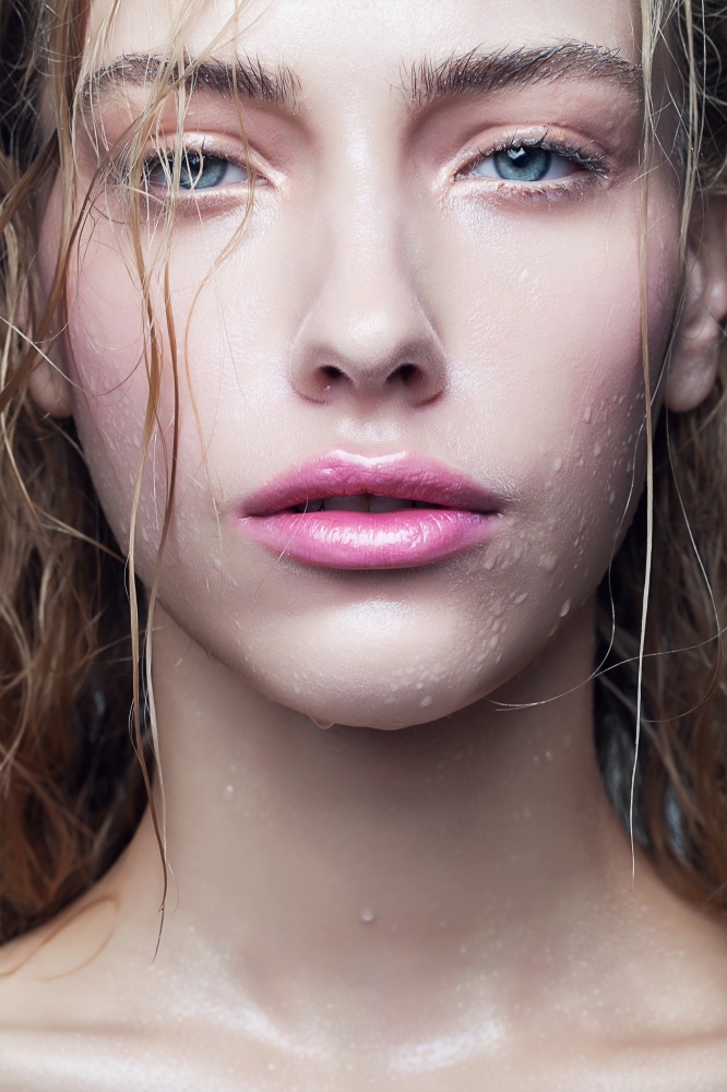 portrait of woman with drops on face