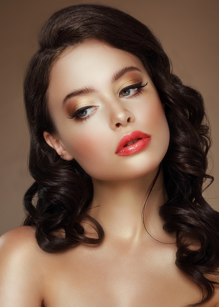 Visage. Evening Makeup. Stylish Woman with Golden Eyeshadows