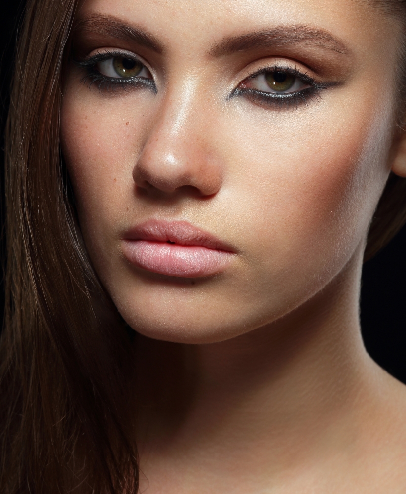 Studio Portrait of Young Brunette with Healthy Skin
