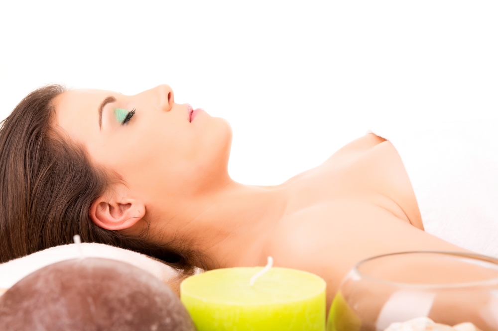 A young beautiful woman relaxing at a spa (wellness concept)