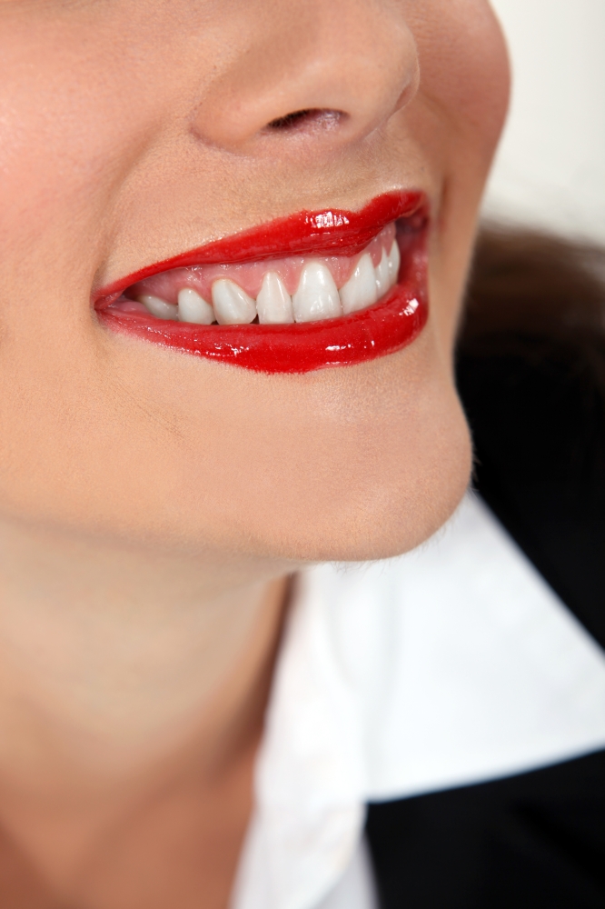 Closeup of a woman wearing red lipstick