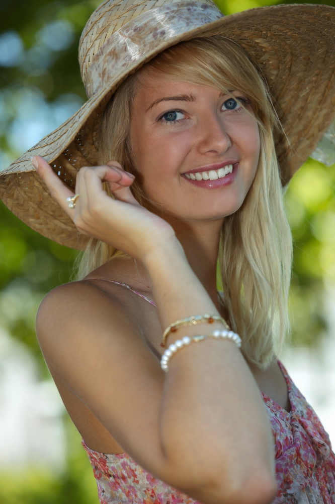 Woman wearing summery straw hat