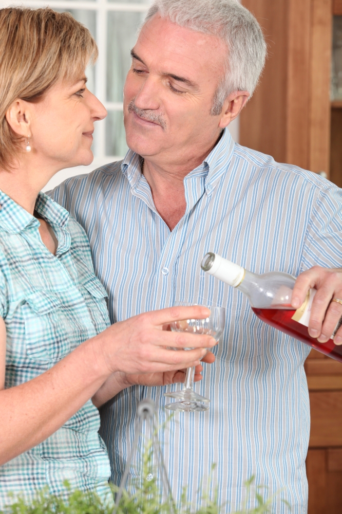 Middle-aged couple with wine