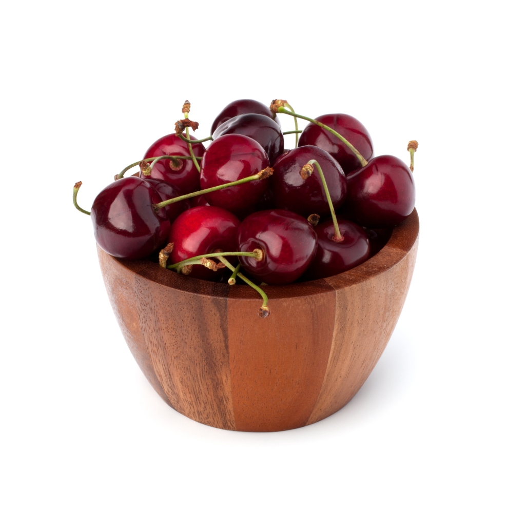 Cherry in wooden bowl isolated on white background