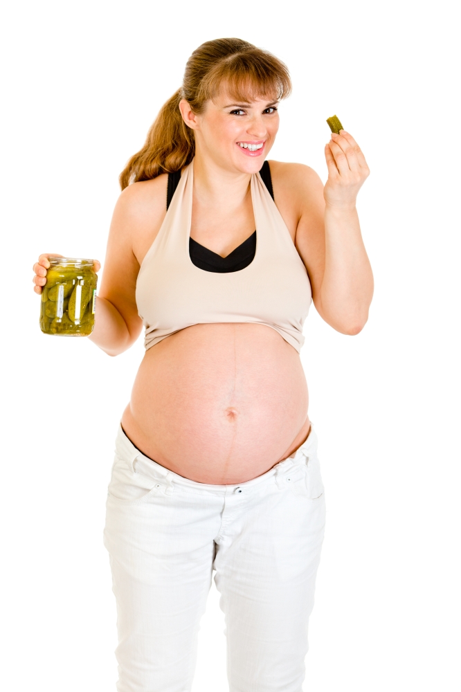 Smiling  beautiful pregnant woman  eating pickles isolated on white&#xA;