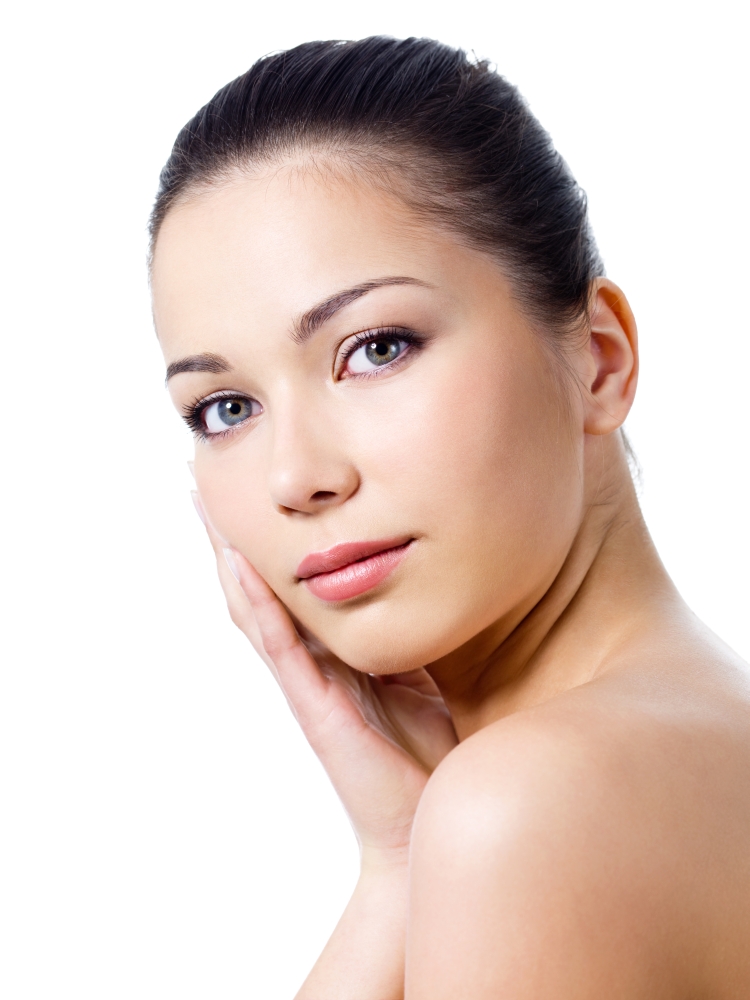 Close-up portrait of young beautiful woman with healthy skin touching her face - isolated
