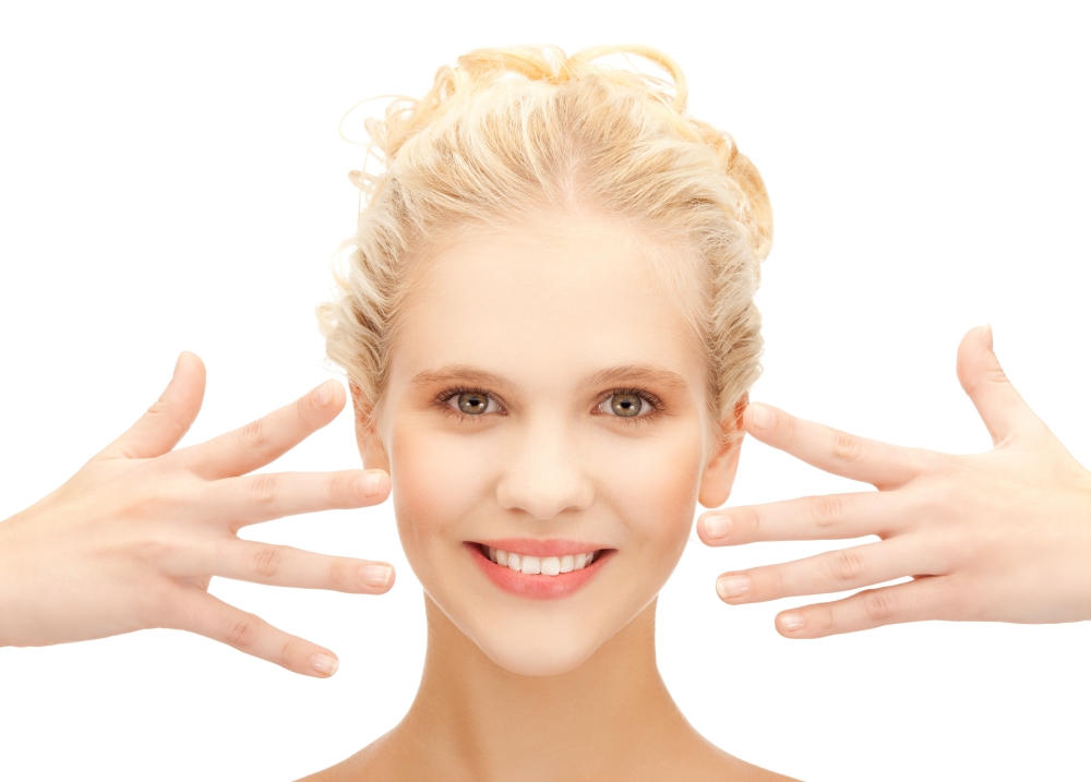 health and beauty concept - picture of beautiful teenage girl showing her hands