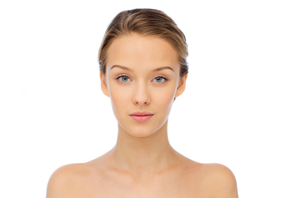 beauty, people and health concept - young woman face and shoulders
