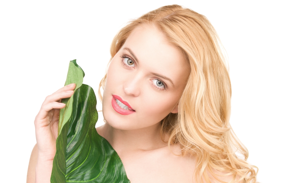 picture of woman with green leaf over white