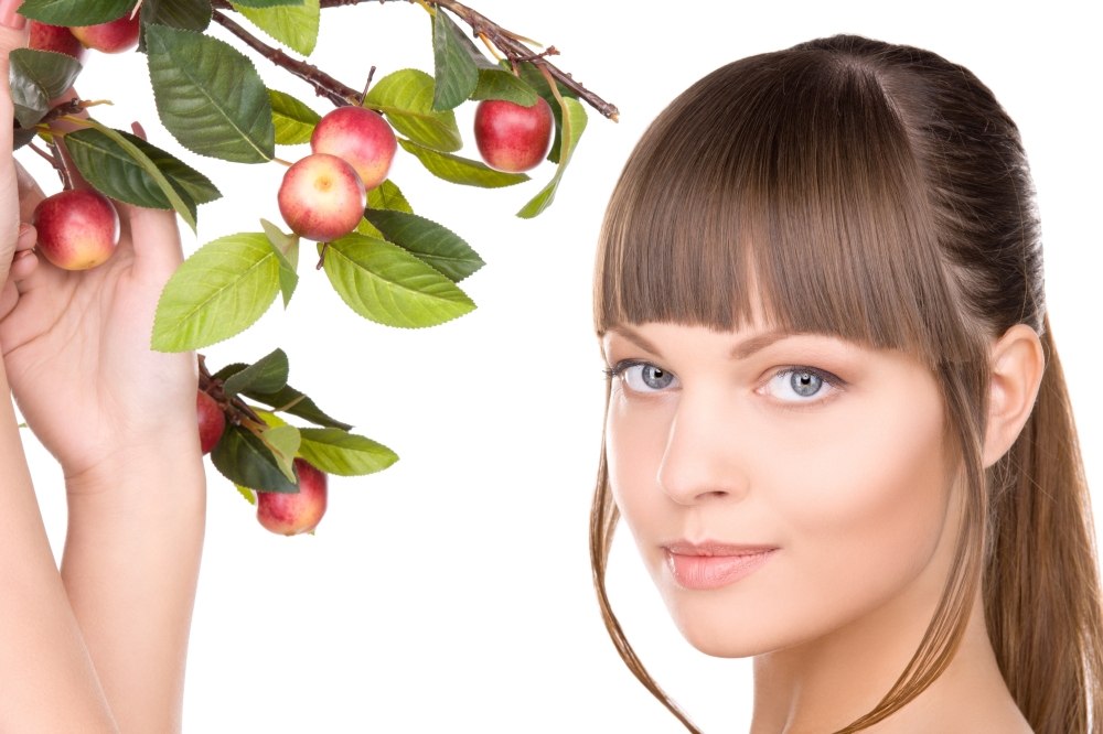 picture of lovely woman with apple twig