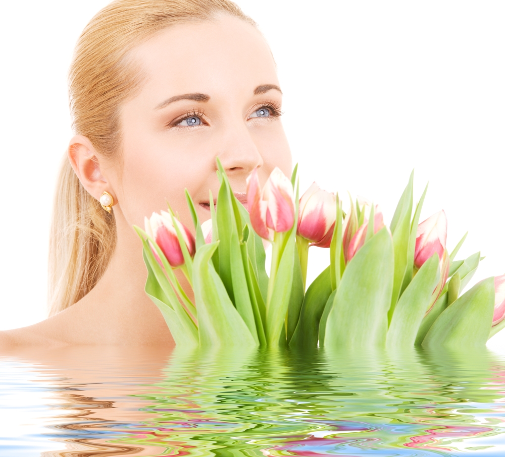 picture of happy woman with flowers in water