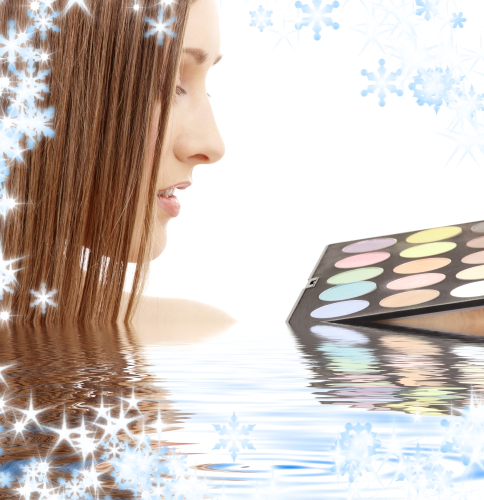 lovely woman with eyeshadow palette in water