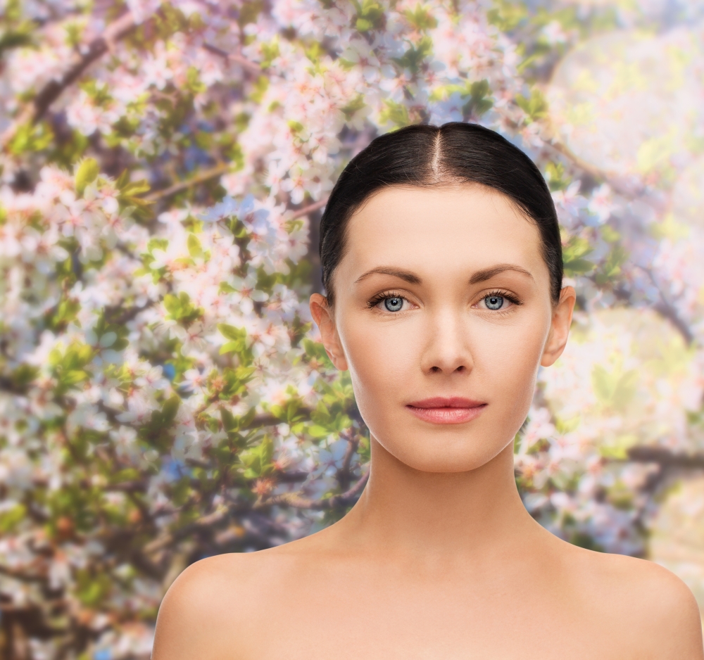 health, spring and beauty concept - clean face of beautiful young woman