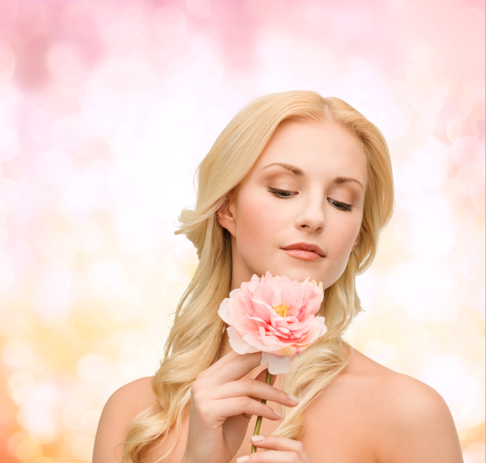 floral and beauty concept - lovely woman with peony flower