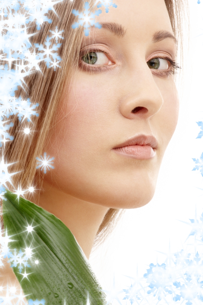 lovely woman with green leaf and snowflakes