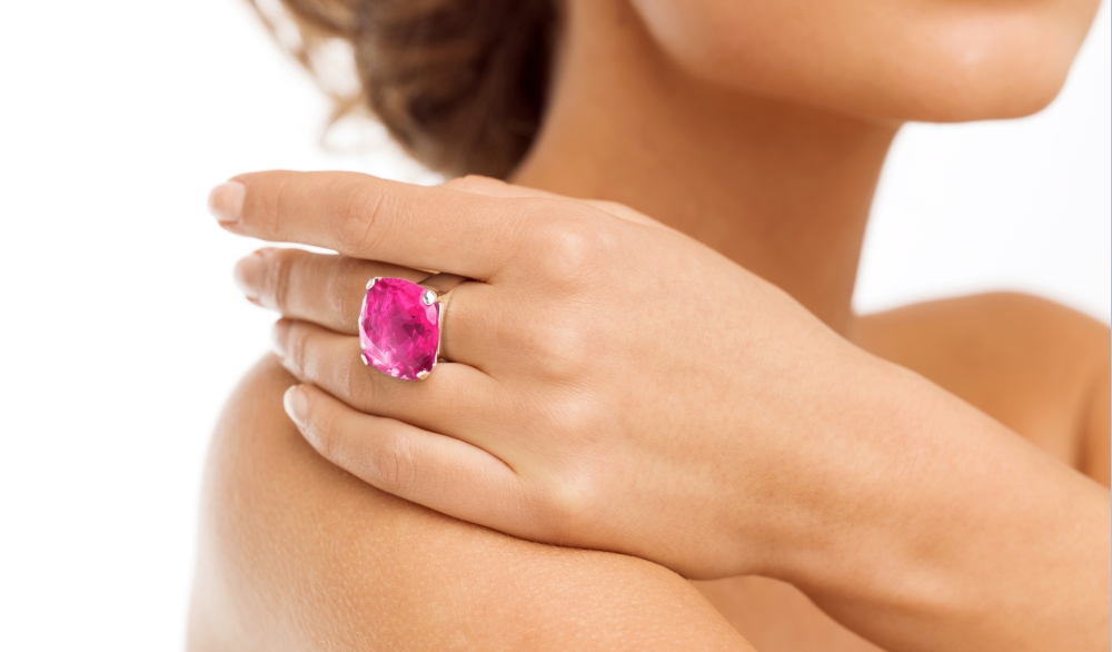 wedding, bridal jewelry and luxury concept - picture of beautiful woman with big pink cocktail ring