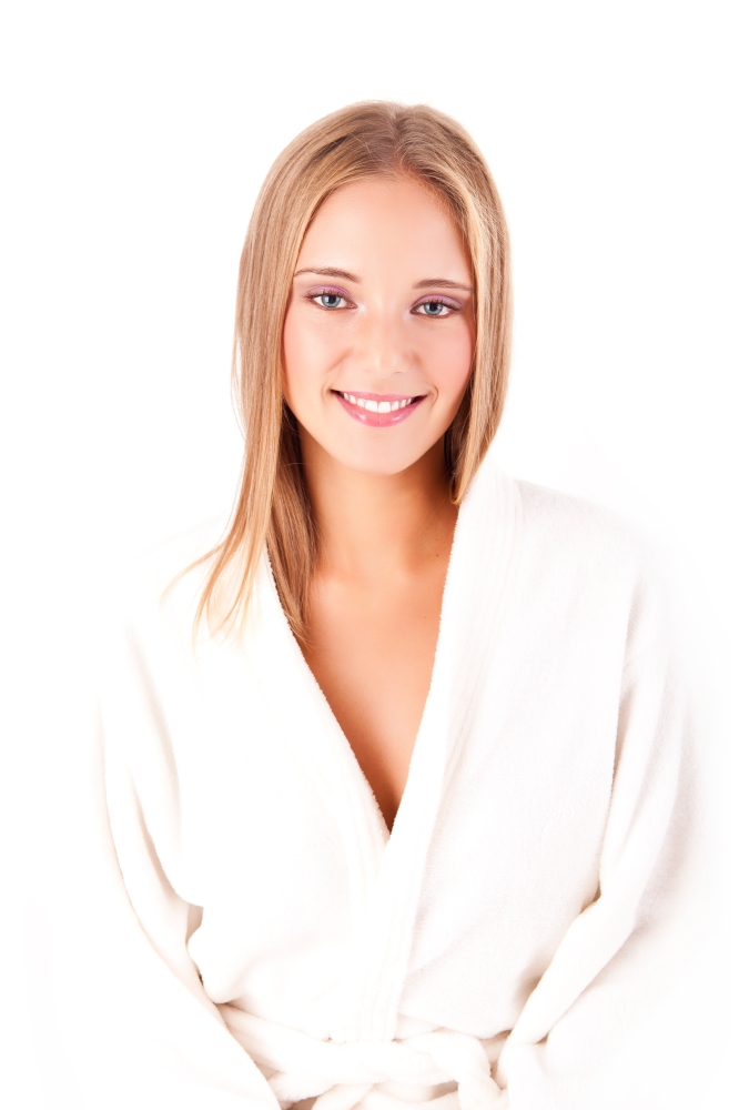Portrait of a beautiful healthy young blonde woman in a white spa bath robe