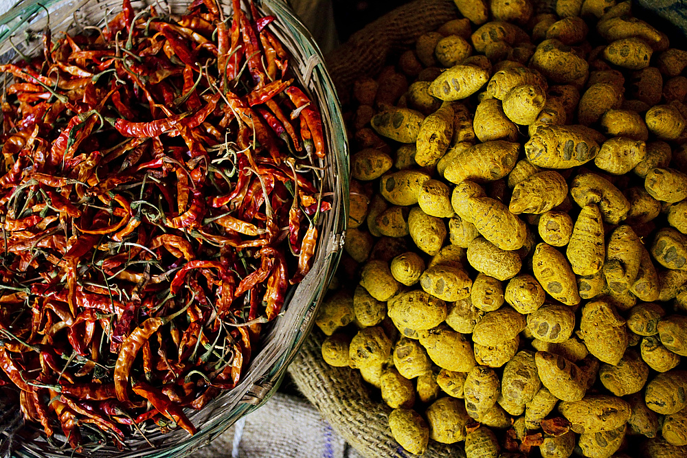 Dried chillies and turmeric root for sale at the market