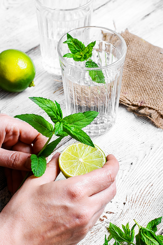 Refreshing cocktail with lime fruit,water, and peppermint