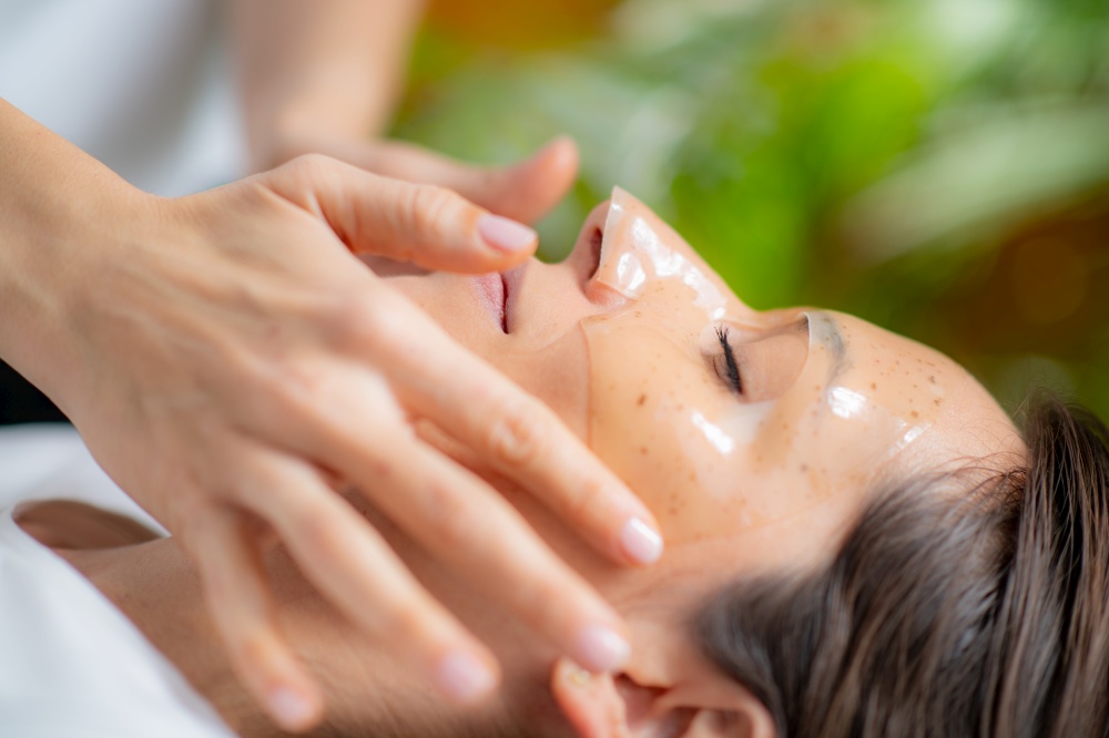 Woman enjoying in a luxurious skincare treatment with a face mask at the beauty salon