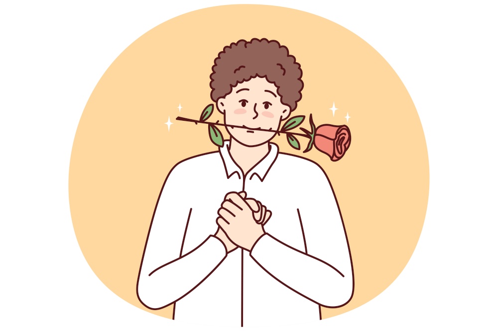 Timid young guy with rose in mouth clenching palms in front of chest looks at screen with head tilted to side. Man in white shirt hopes girl will like him and invite lover on date. Timid young guy with rose in mouth clenching palms in front of chest