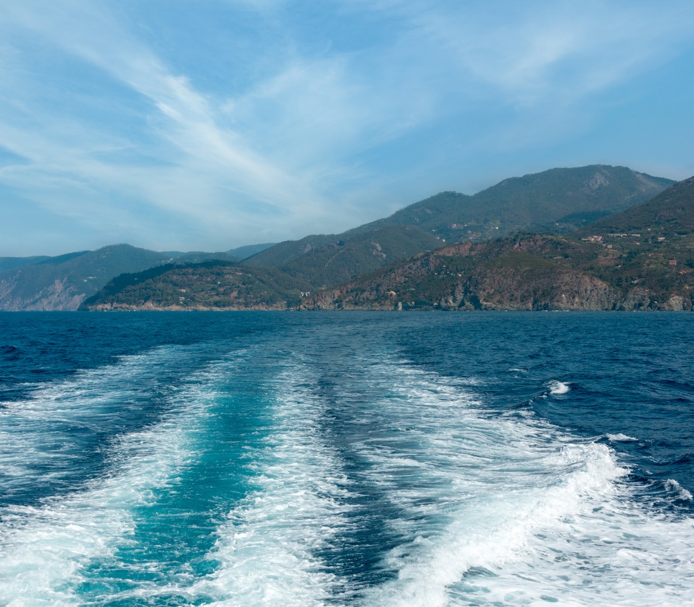 Beautiful summer Levanto village coast view from excursion ship. Right near famous Cinque Terre National Park in Liguria, Italy,