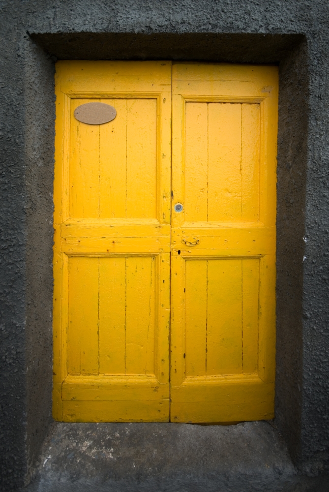 Brightly colour doors in the tiny fishing village of Riomaggiore, Cinque Terre, Italy