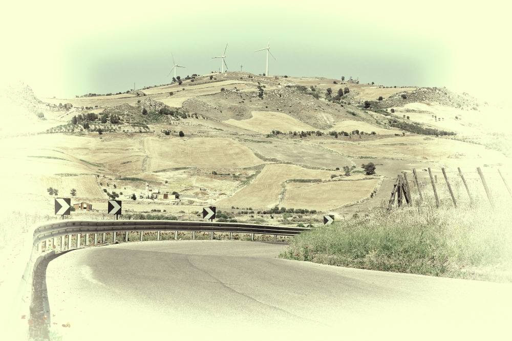 Winding Asphalt Road on the Background of the Modern Wind Turbines in Sicily, Retro Image Filtered Style